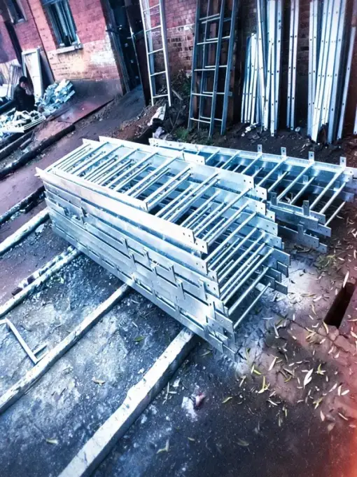 Cat ladder sections and extension pieces stacked