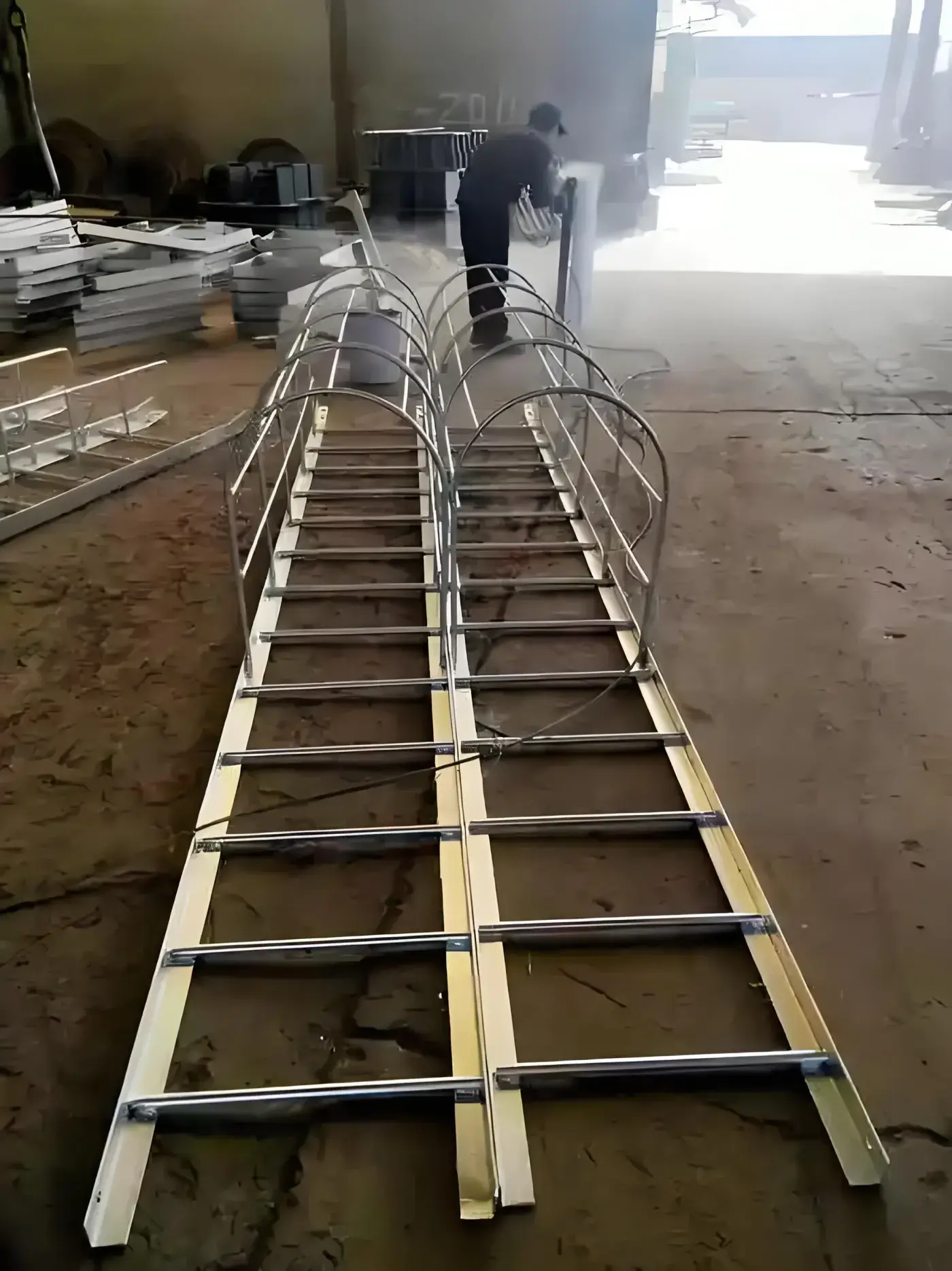 Factory workshop with made to order caged cat ladders in production